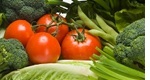 Assorted green vegetables and tomatoes, extreme close up